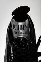 Detalle de la lengüeta PUMA plateada Design West Germany.