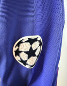 Plano detalle del logo Champions